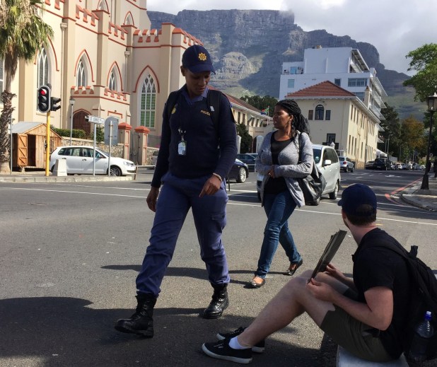 police-looks-at-sign